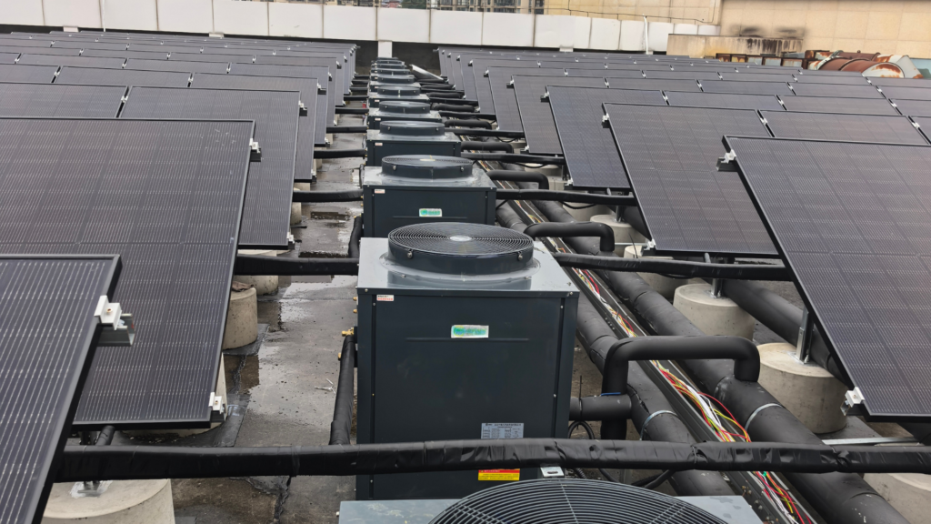 PVT solar heat pump system installed on hotel rooftop producing 60 tons of hot water per day above 60°C