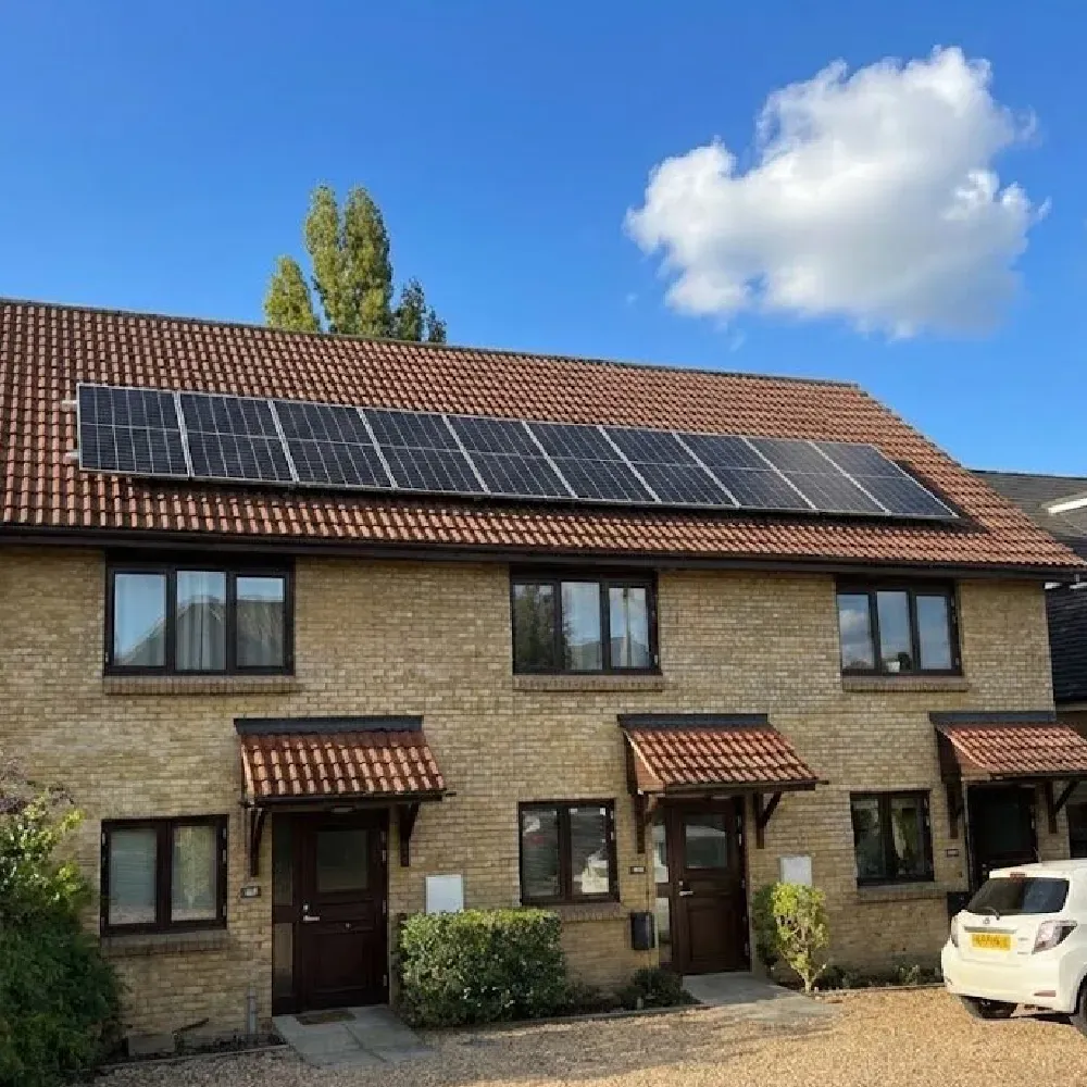 10-panel PVT collector array installed on a UK residential rooftop, configured for ground source heat pump borehole regeneration