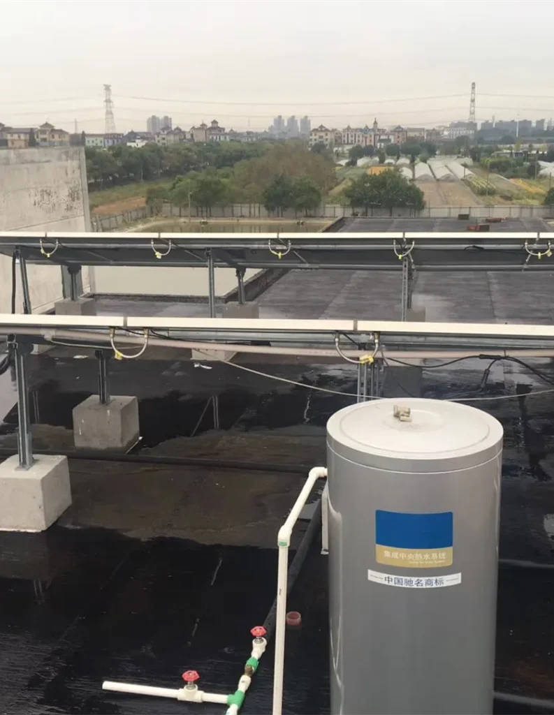 12-panel PVT array on a flat residential rooftop, configured for solar domestic hot water production